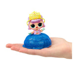 Toy figure with purple hair and yellow crown on a blue glittery base held in a hand against a white background