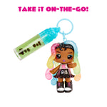 Toy keychain with a small doll and lip gloss on a white background with text 'Take it on-the-go!