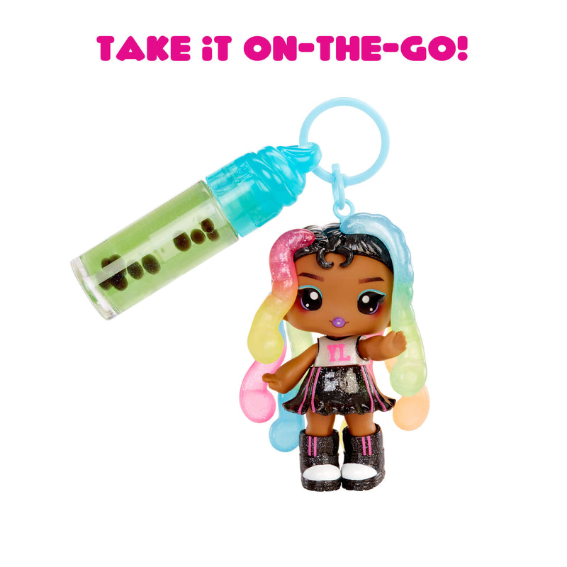Toy keychain with a small doll and lip gloss on a white background with text 'Take it on-the-go!