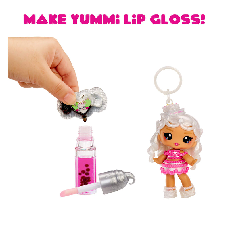 Make Yummi Lip Gloss toy set with doll and lip gloss bottle on a white background