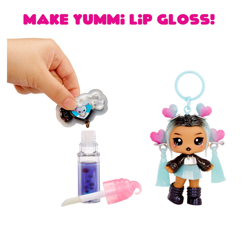 Make Yummi Lip Gloss toy set with doll and accessories on a white background