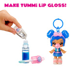 Toy doll with blue hair and a small bottle, with text 'MAKE YUMMI LIP GLOSS!' on a white background.