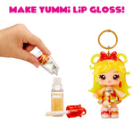 Make Yummi lip gloss kit with a small doll figure and lip gloss bottles on a white background.