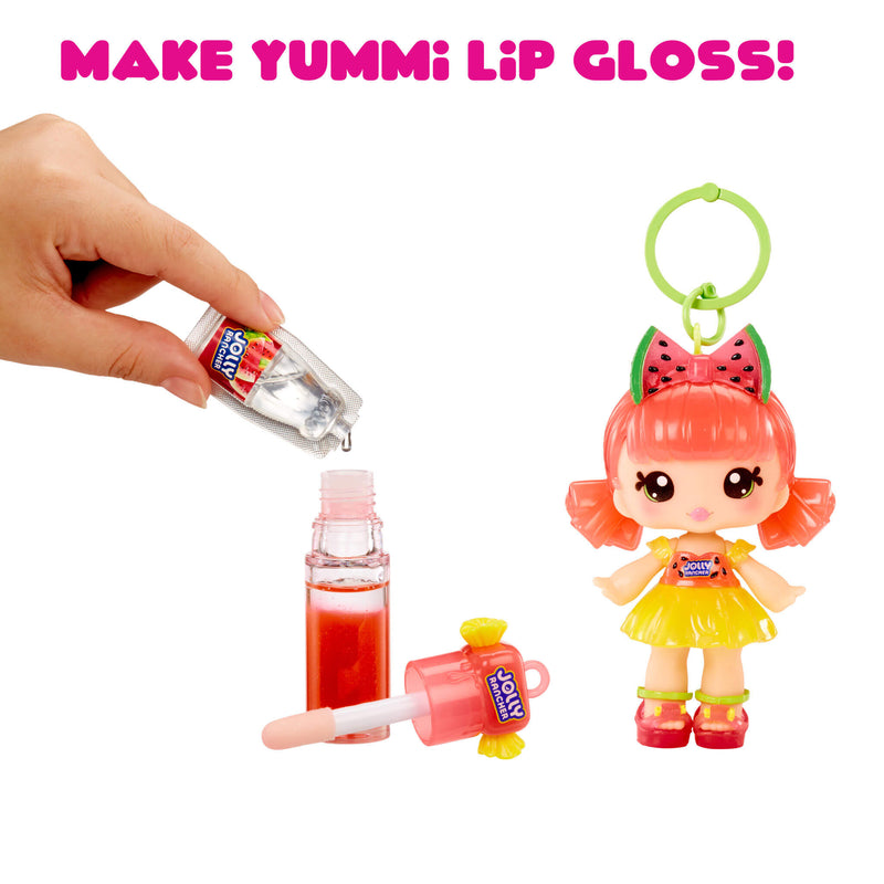 Make Yummi Lip Gloss toy set with a hand applying lip gloss and a character figurine.