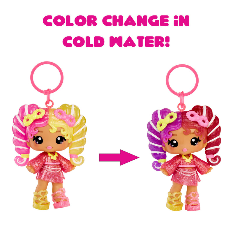 Toy keychain with color-changing feature in cold water, showing transformation from yellow to purple hair.