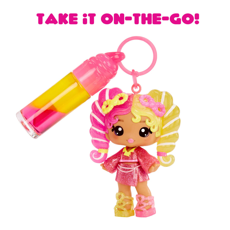 Toy figure with pink and yellow hair and accessories, including a keychain, on a white background with text 'Take it on-the-go!'.