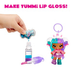 Make Yummi Lip Gloss toy set with a character and lip gloss components on a white background.