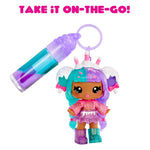 Colorful toy figure with a keychain and text 'Take it on-the-go!' on a white background