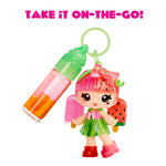Colorful keychain with a small character and drink on a white background