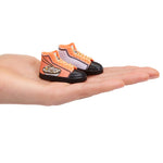 sneakers in palm of hand