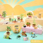 Miniature gardening set with plants, pots, and tools on a colorful background