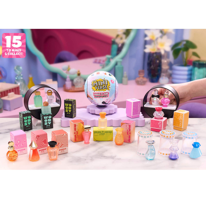 Collection of miniature perfume bottles and packaging on a decorative surface with a 'Mini World' sign.