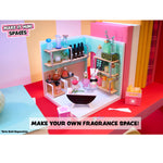 Miniature fragrance display with shelves and bottles on a colorful background