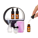 Set of essential oil bottles, a dropper, and a box labeled 'Jasmine' on a white background.