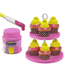 Pink cupcake stand with Peeps marshmallow chicks and a jar of pink candy.