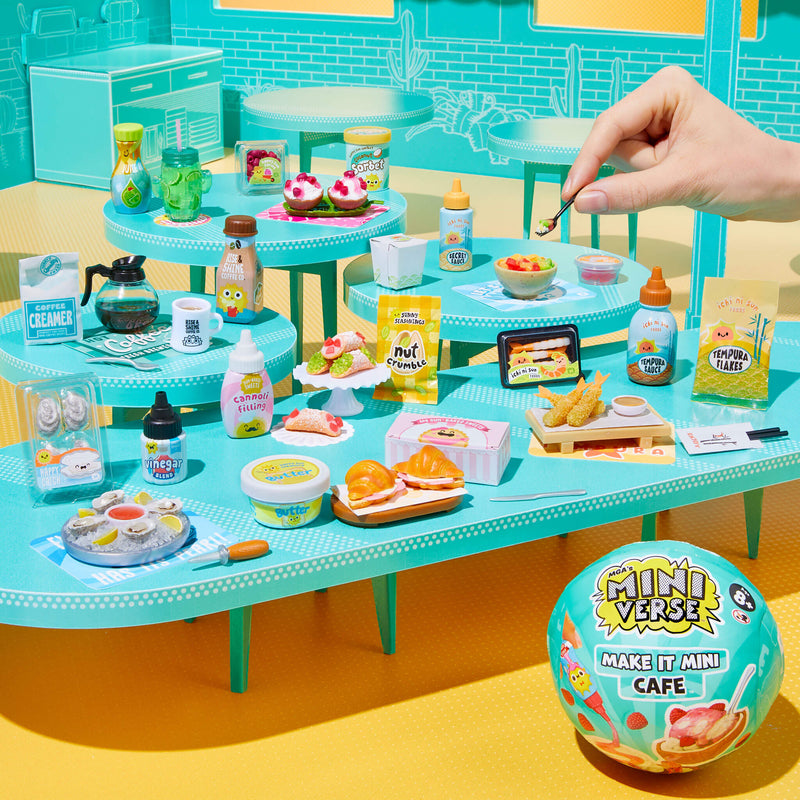Miniature cafe set with various food items and a hand interacting with them, featuring 'MiniVerse' branding.