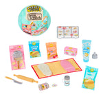 Miniature baking set with tools and ingredients on a white background