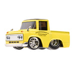 Yellow toy truck with 'Custom Equipment Co. Speedshop' branding on a white background