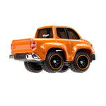 Orange toy truck with large wheels on a white background