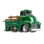 Green toy truck with wooden bed on a white background