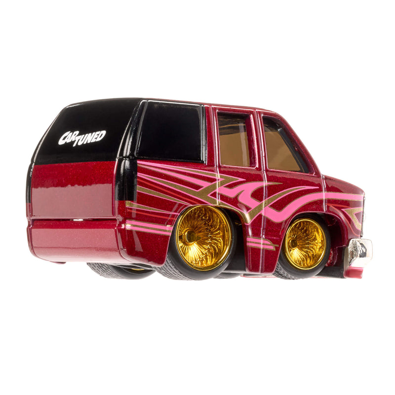 Red toy car with gold rims on a white background