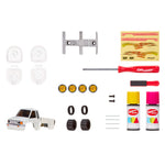 Collection of car parts and tools on a white background