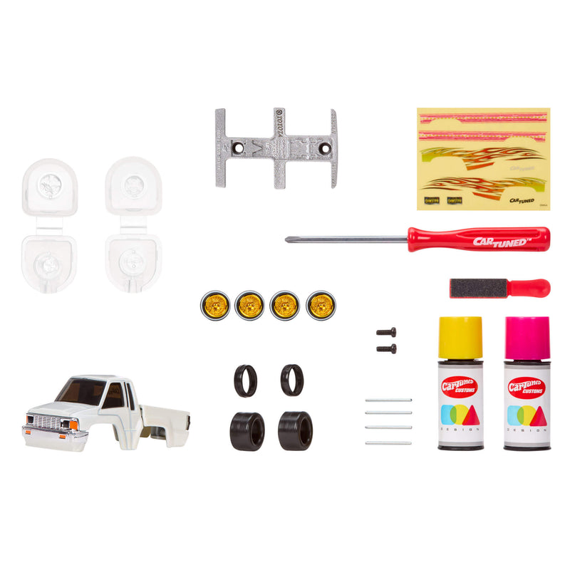 Collection of car parts and tools on a white background