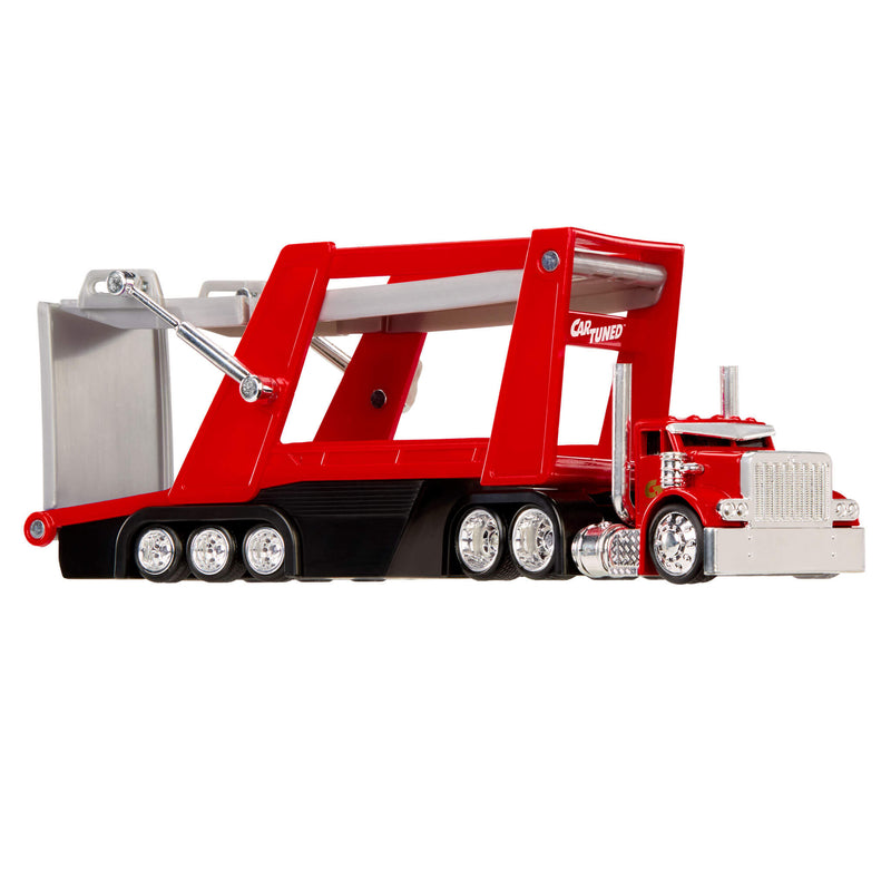 Red toy truck with a large trailer on a white background