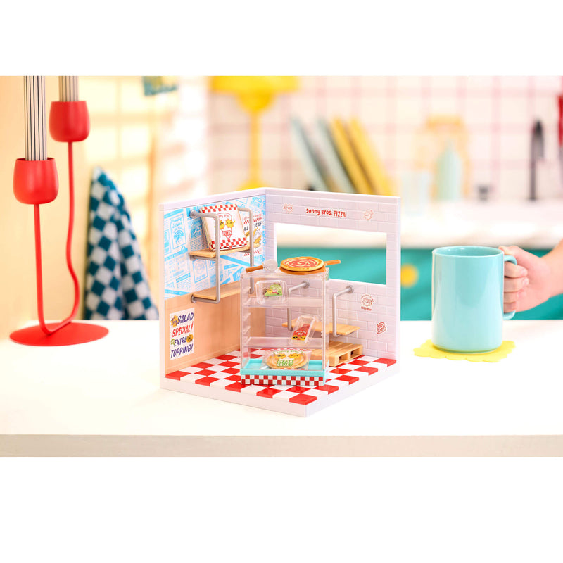 Mini Pizza set in packaging on a table with a blurred background