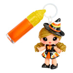 Halloween-themed keychain with a small witch figurine and candy corn design.