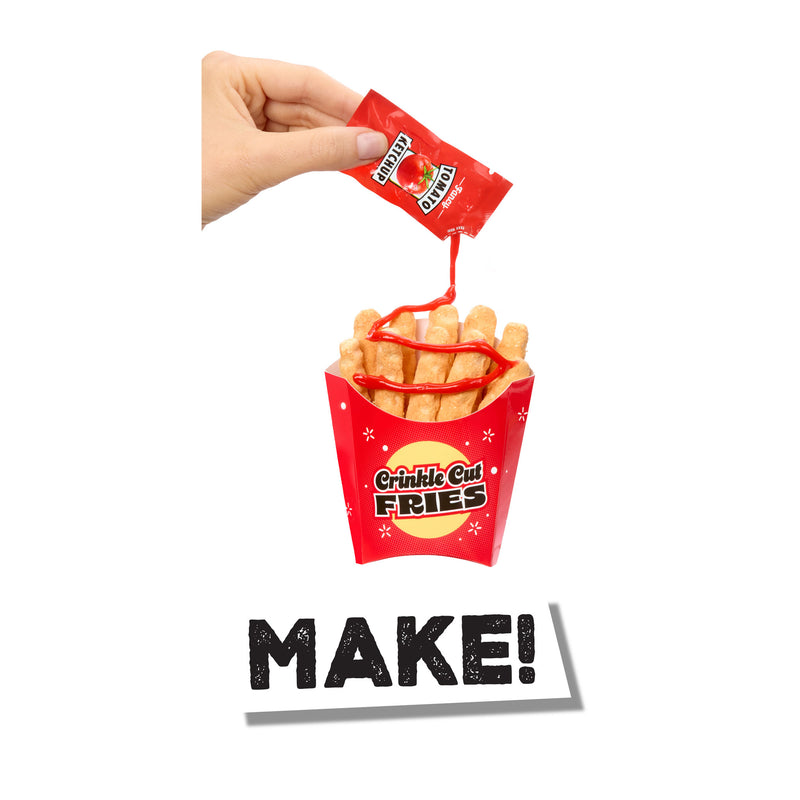 Red container of Crinkle Cut Fries with a hand holding a packet above it, on a white background.