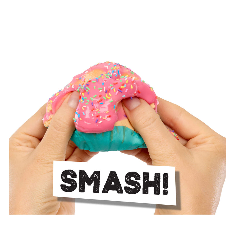 Hands holding the cupcake with 'SMASH!' text on a white background