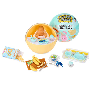 Miniature baby with accessories on a white background