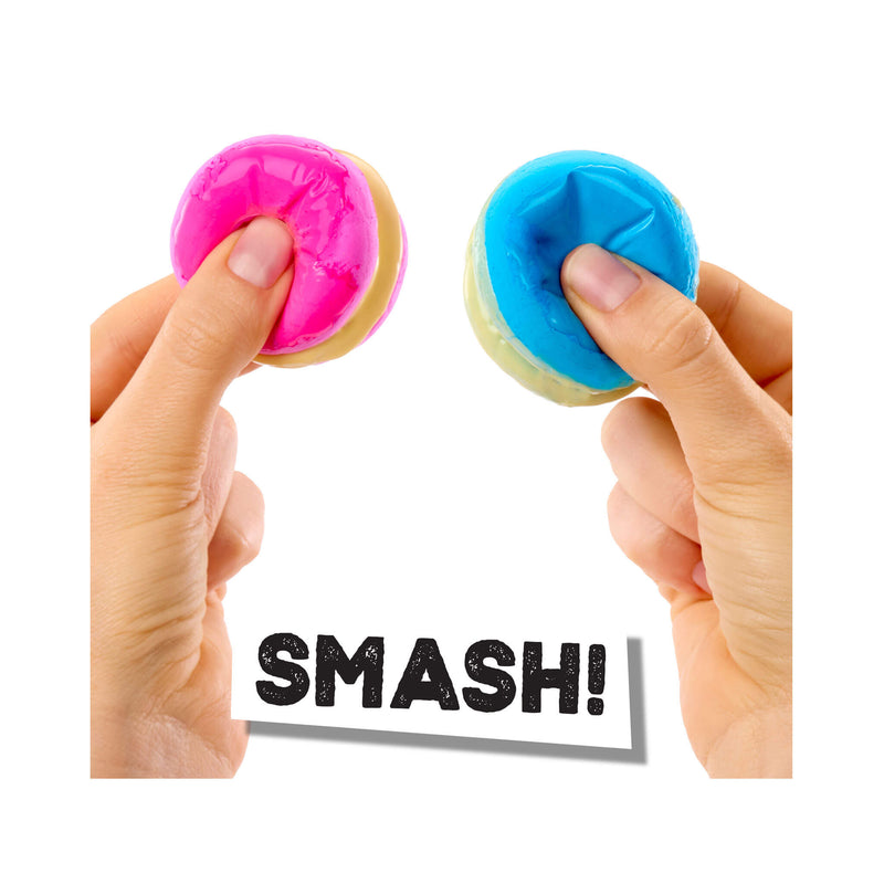 Two colorful Macarons being squeezed with the word 'SMASH!' displayed below.