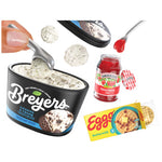Breyers cookies & cream ice cream container with a jar of strawberry jelly and a box of Eggo waffles on a white background.