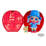 Strawberry Shortcake toy with blue hair and outfit by a strawberry shaped case on a white background
