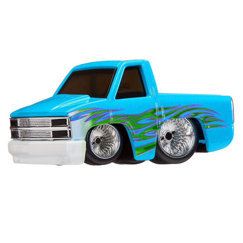 Toy truck with blue body and green flames on a white background