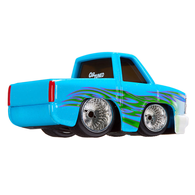 Blue toy truck with flame design on a white background