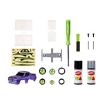 Collection of model car accessories including a purple car base, wheels, tools, and paint cans on a white background