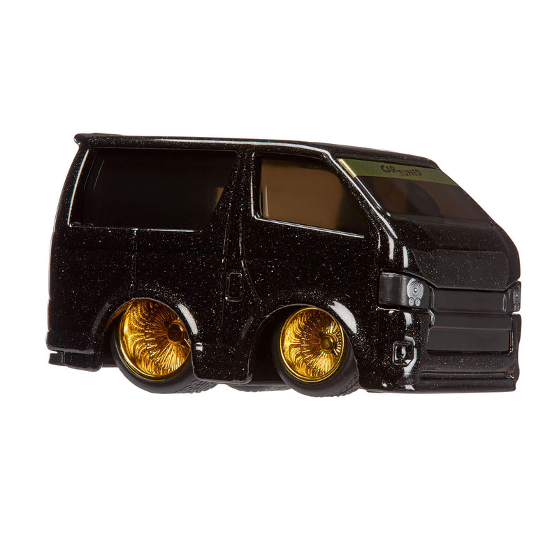 Black Toyota HiACE van with gold wheel rims on a white background