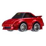 Red toy car with chrome wheel rims on a white background