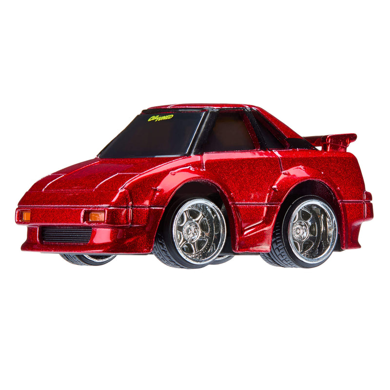 Red toy car with chrome wheel rims on a white background