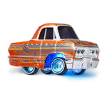 Toy car with a retro design and blue light underneath on a white background