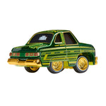 Green toy car with gold accents on a white background