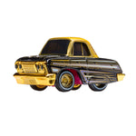 Gold and black toy car on a white background