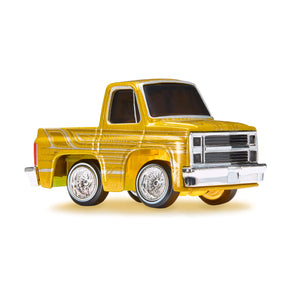Yellow toy truck on a white background