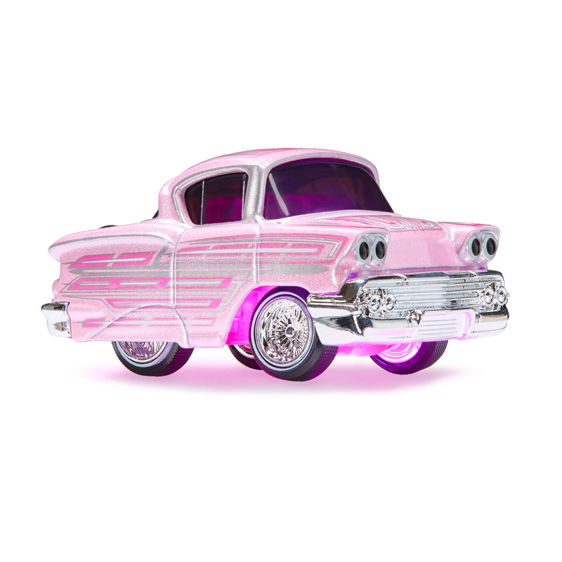 Pink vintage car model on a white background