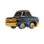 Model car with blue and gold design on a white background
