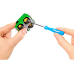Person using a blue screwdriver to connect the cars top and bottom on a white background