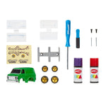 Collection of model car accessories including a green van, wheels, tools, and paint cans on a white background.